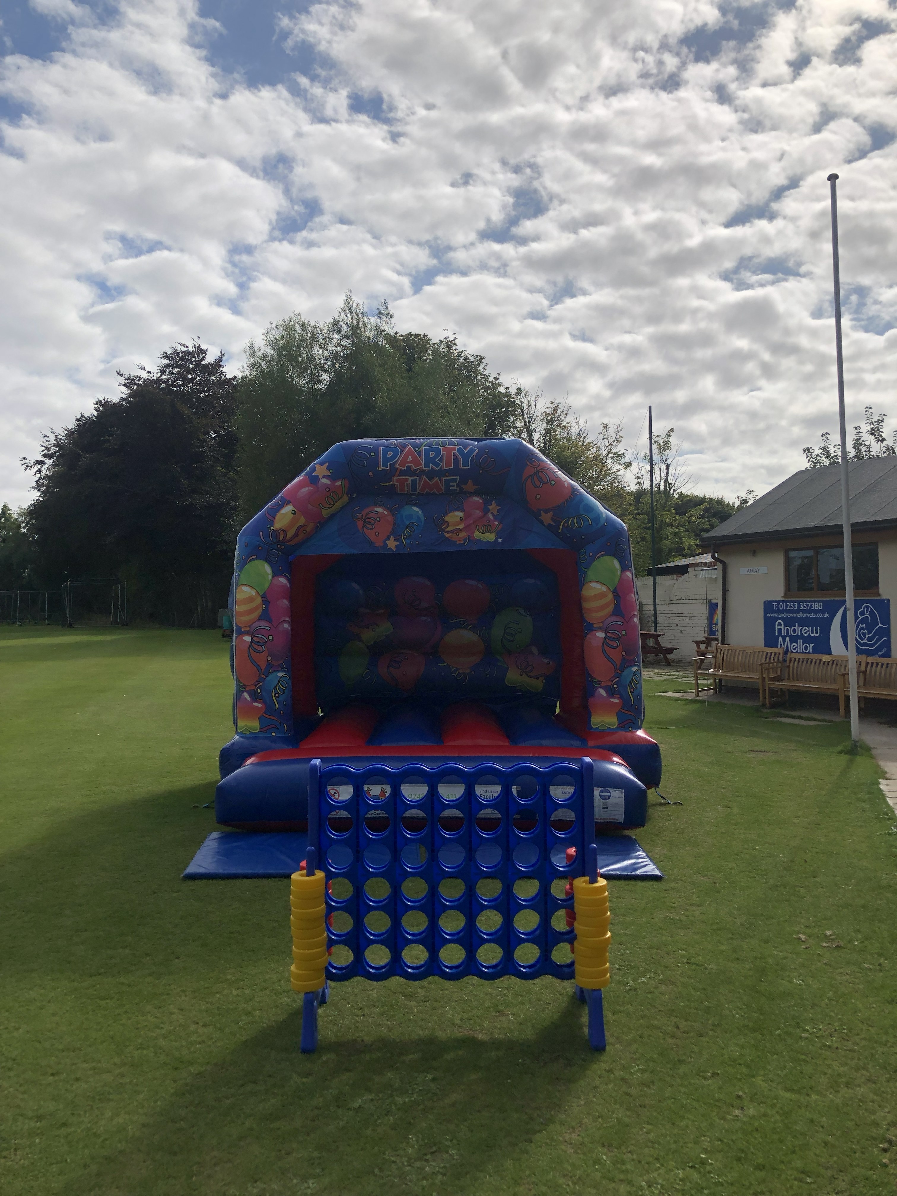 Bouncy castle hire setup at Thornton Cleveleys Cricket Club by Fylde Coast Bouncy Castles.
