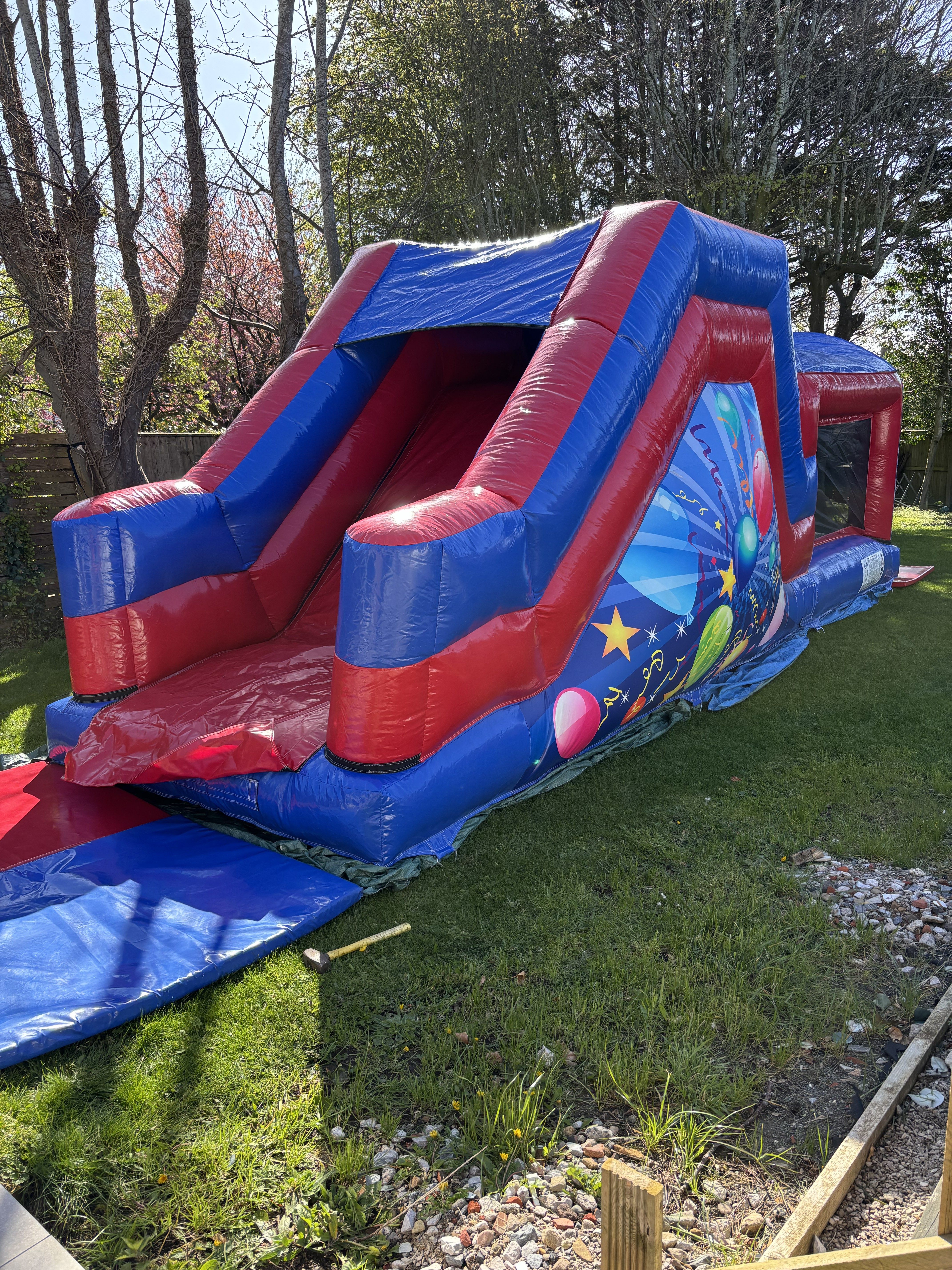 27ft inflatable assault course setup for a party in Poulton by Fylde Coast Bouncy Castles.