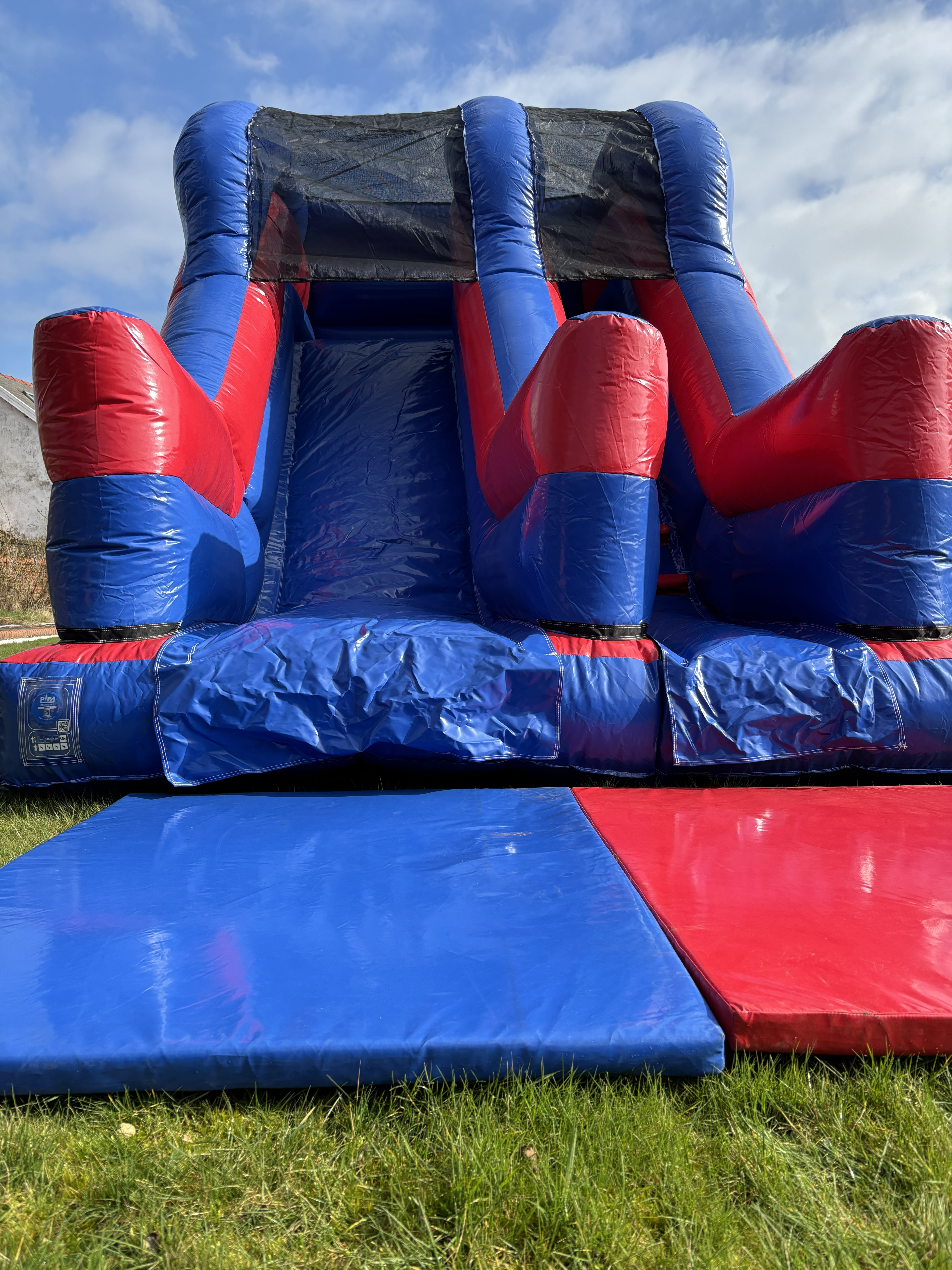 Large inflatable slide for hire in Lytham by Fylde Coast Bouncy Castles.