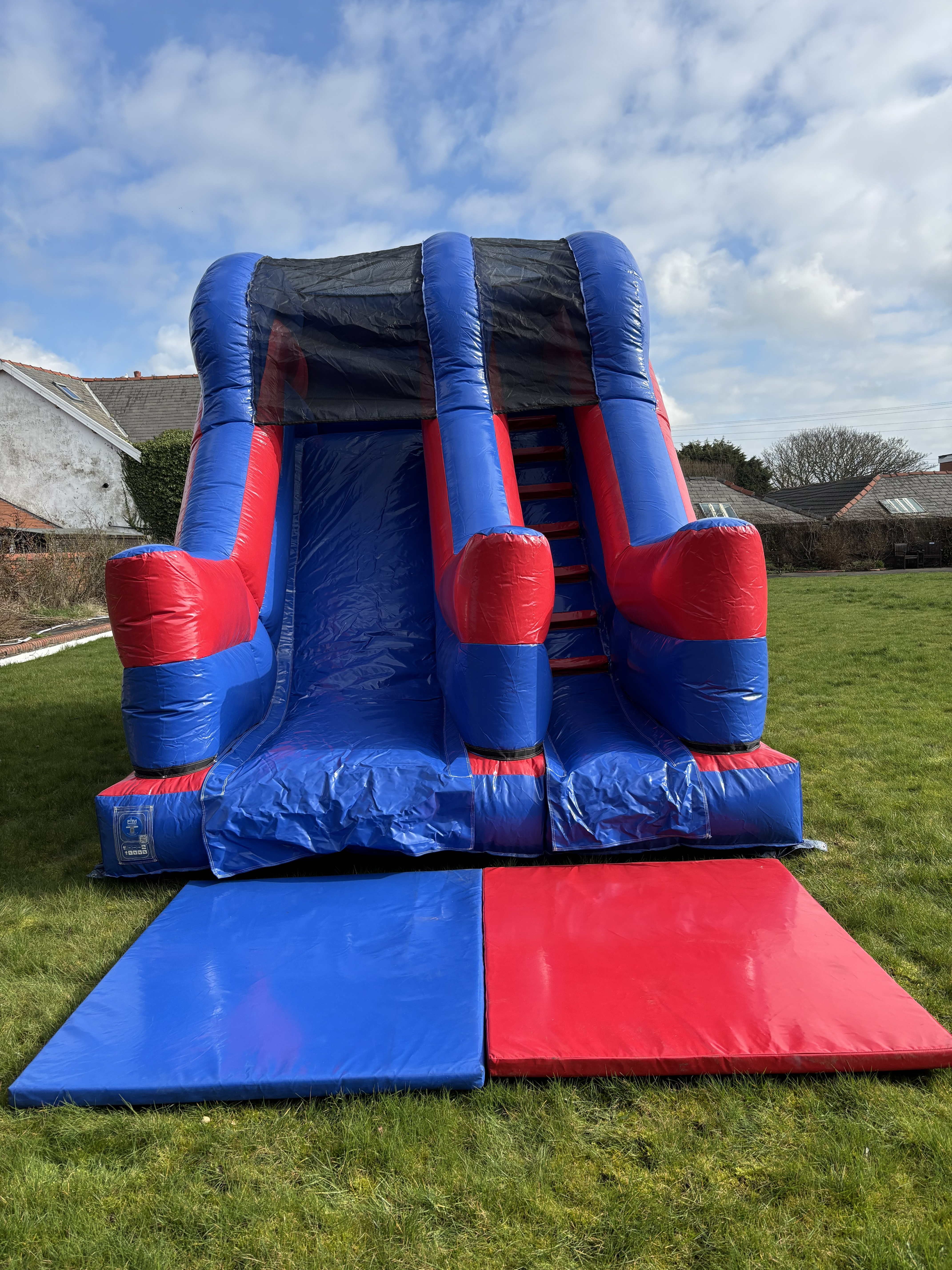 Premium inflatable slide setup for a large garden party in Wrea Green by Fylde Coast Bouncy Castles.